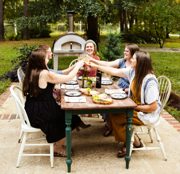 http://www.fontanaforniusa.com/cdn/shop/articles/women-at-a-airbnb-using-a-fontana-forni-pizza-oven.png?v=1689786848